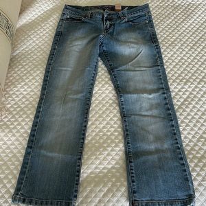 “flood” style crop denim distressed wash; boutique brand low rise waist